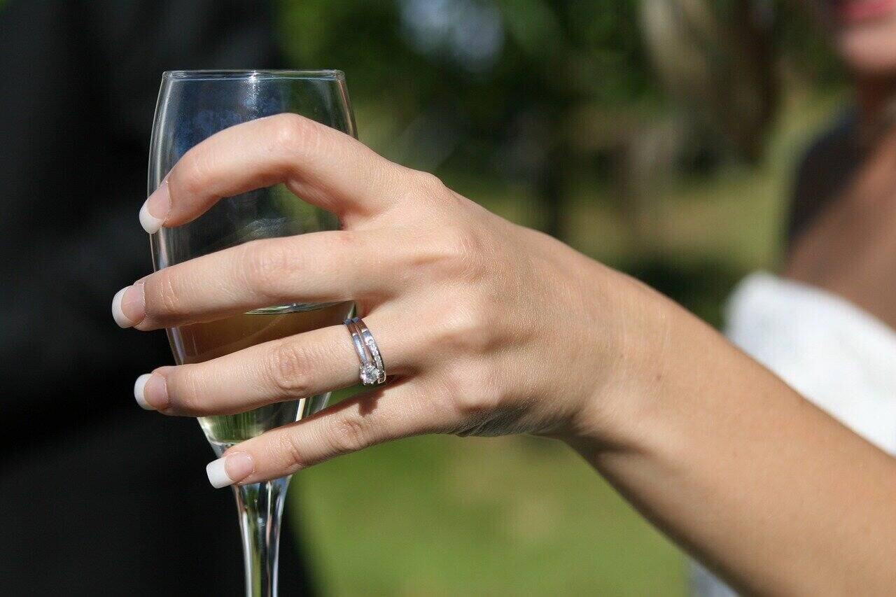 a married hotwife with a ring on her finger
