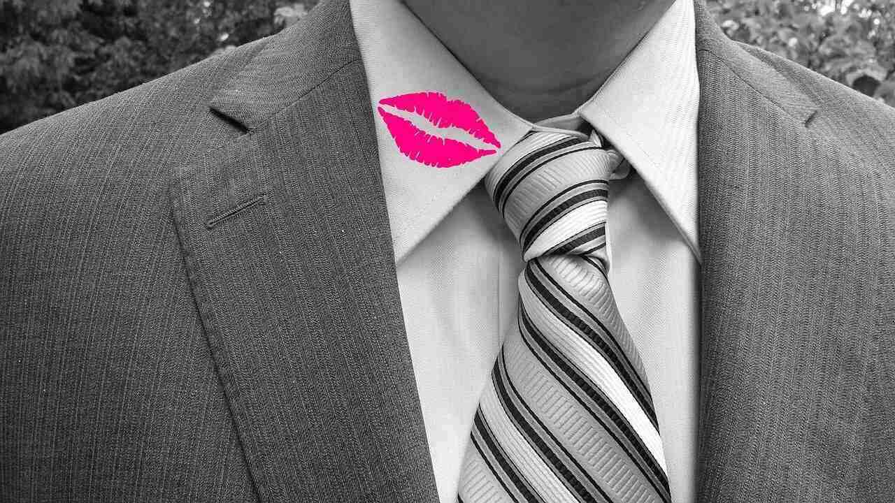 a cheating husband who has lipstick on his shirt collar